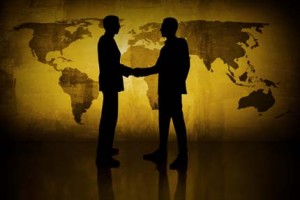 Global businessmen shaking hands. They need Powerlinx